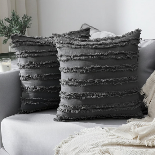 Boho textured fringe throw pillow cover with decorative tassels, made by The Finishing Touch Decor, showcasing intricate woven details.