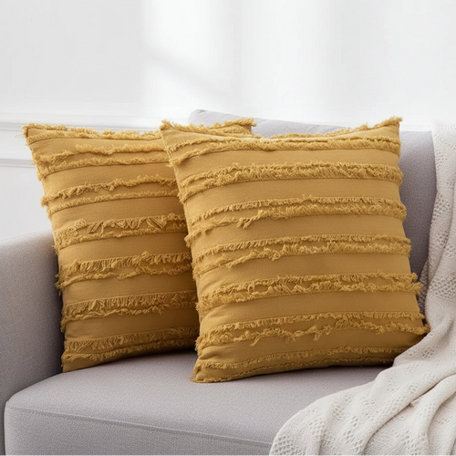 Boho textured fringe throw pillow cover by The Finishing Touch Decor with woven fabric and decorative fringe details.