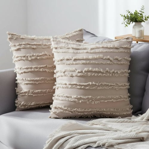 Boho textured fringe throw pillow cover from The Finishing Touch Decor with tassel details and woven design.