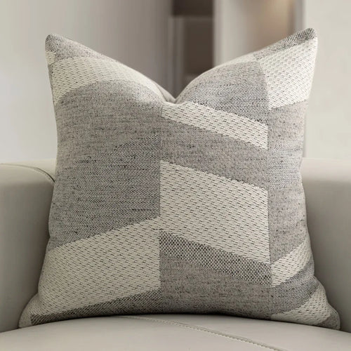 Grey geometric cushion cover by The Finishing Touch Decor, featuring a modern, wool-blended fabric for sofa or bed decor.