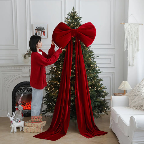 Large red velvet Christmas holiday decorative bow from The Finishing Touch Decor, perfect for festive holiday decor.