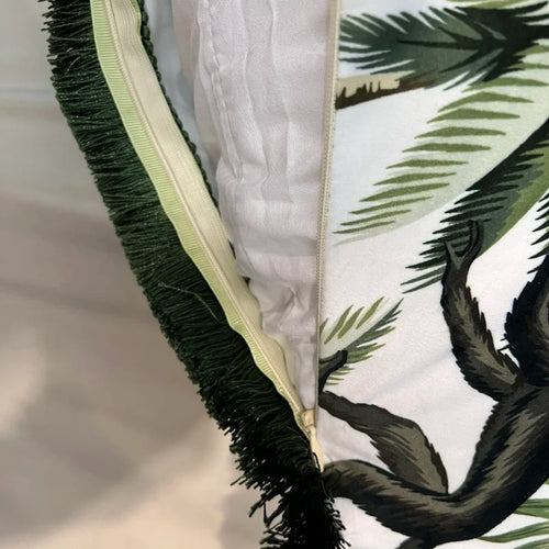Velvet tropical monkey and palm tree throw pillow cover in vibrant colors, featuring a lush jungle design.