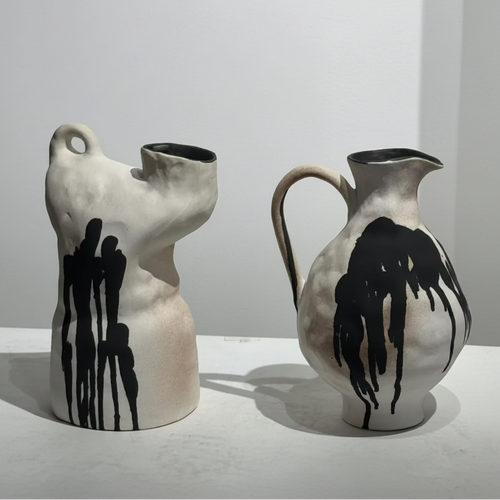 Handmade decorative vase with irregular shape and ink drip design, perfect for modern interior decor.