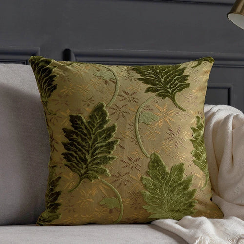 Vibrant embroidered leaf throw pillow cover from The Finishing Touch Decor, featuring colorful leaf patterns on fabric.