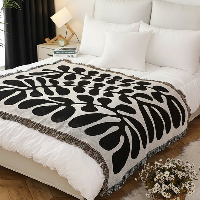 Warm Thread blanket for camping and sofa, retro American-style throw blanket by The Finishing Touch Decor on a cozy bed.