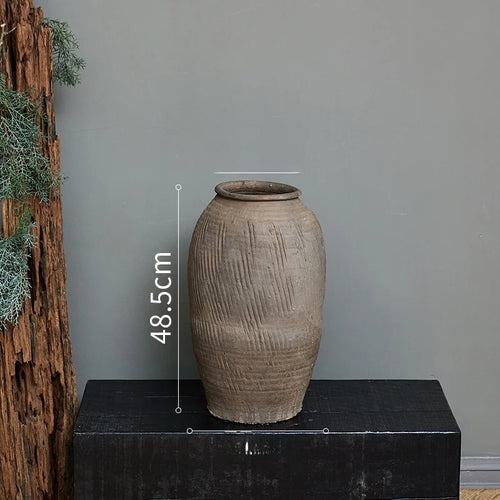 Rustic Zen large terracotta floor vase from The Finishing Touch Decor, decorative vase with a natural earthy finish.