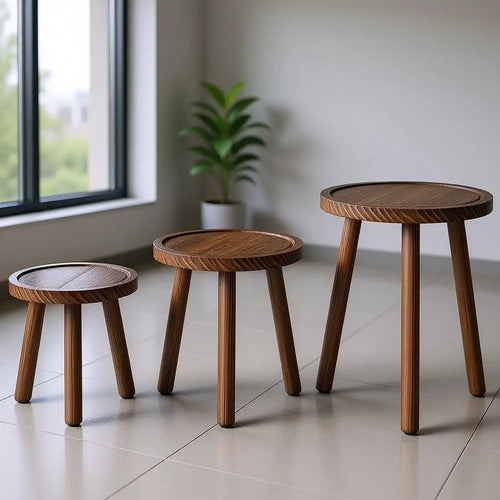 Set of three small wooden planter stand stools for indoor decor, featuring natural wood finish and compact design.