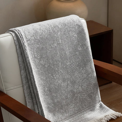 Soft grey gauze blanket made of pure cotton, featuring a lightweight, breathable design from The Finishing Touch Decor.