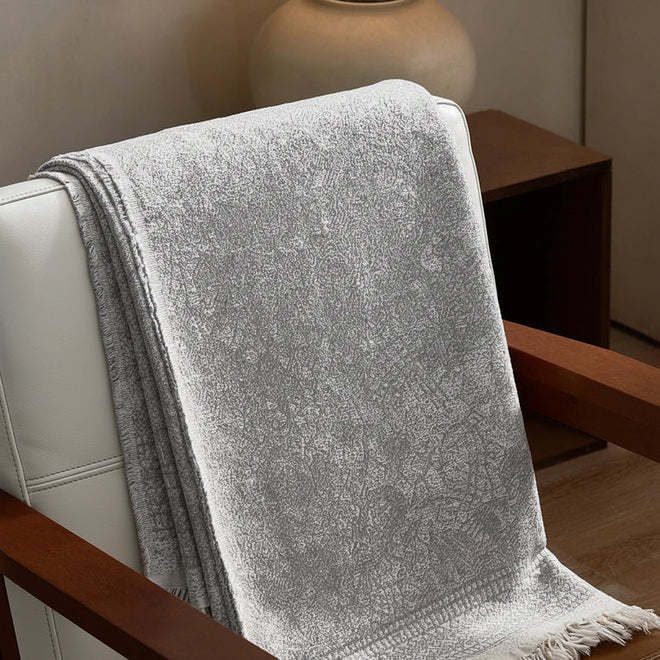 Soft grey gauze blanket made of pure cotton, featuring a lightweight, breathable design from The Finishing Touch Decor.