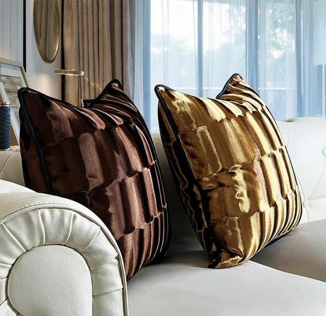 Gold-toned ribbed velvet throw pillow cover with modern abstract design, decorative cushion cover for stylish home decor.