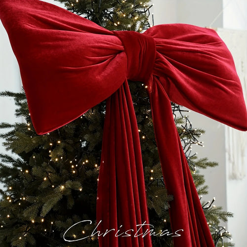 Large red velvet Christmas holiday decorative bow from The Finishing Touch Decor, perfect for festive holiday decor.
