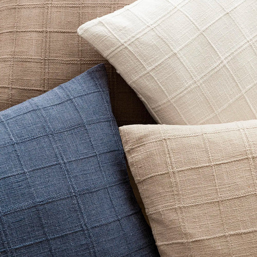 Textured neutral linen and cotton throw pillow cover from The Finishing Touch Decor, showcasing soft fabric and stylish design.