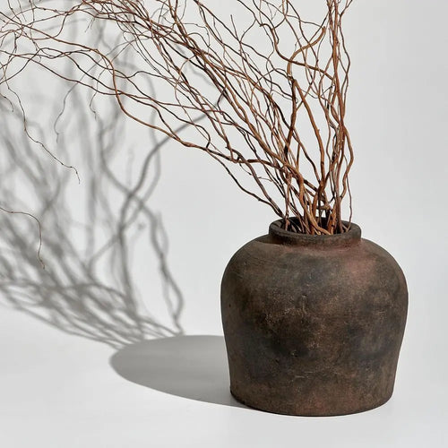 Rustic brown ceramic decorative vase, 11-inch tall, by The Finishing Touch Decor, with textured finish and handcrafted appearance.