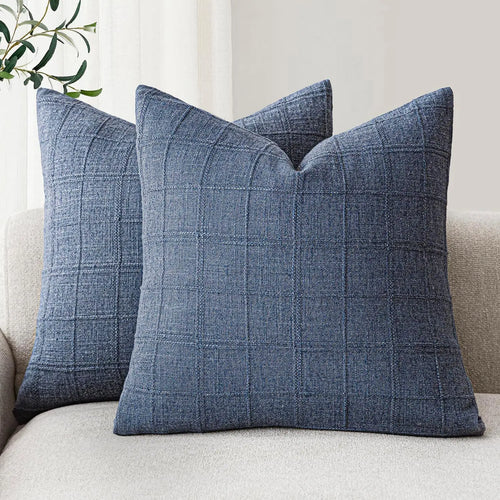 Textured neutral linen and cotton throw pillow cover from The Finishing Touch Decor, showcasing a soft, fabric surface with subtle weave details.
