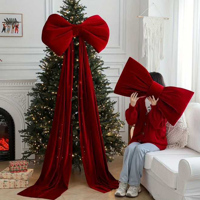 Large red velvet Christmas holiday decorative bow from The Finishing Touch Decor, perfect for festive holiday decorating.