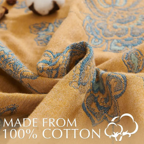 Lightweight cotton muslin reversible quilt throw blanket from The Finishing Touch Decor, soft and breathable for cozy home decor.