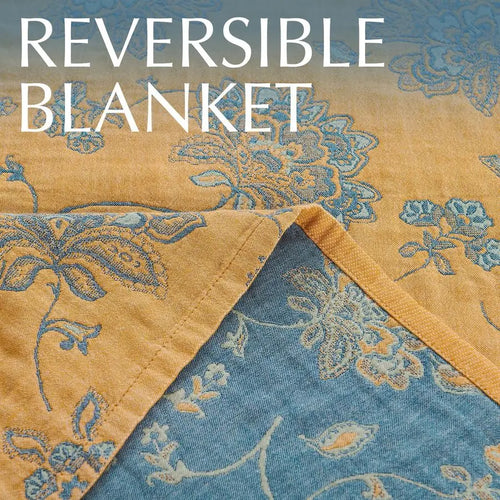 Reversible lightweight cotton muslin quilt throw blanket from The Finishing Touch Decor, showing soft, breathable fabric and cozy design.