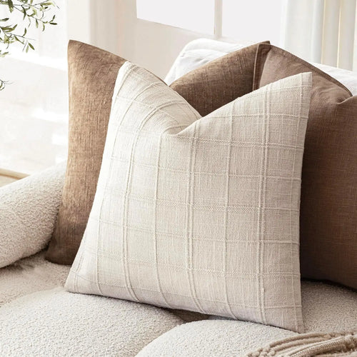 Textured neutral linen and cotton throw pillow cover from The Finishing Touch Decor, showcasing soft fabric and modern design.