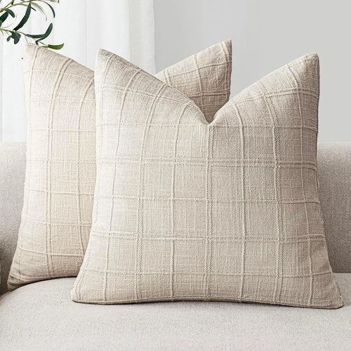 Textured neutral linen and cotton throw pillow covers from The Finishing Touch Decor, showcasing soft fabric and subtle design.