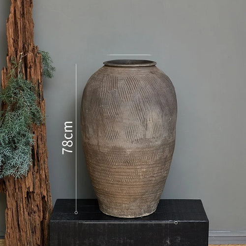 Rustic Zen large terracotta floor vase from The Finishing Touch Decor, decorative vase with a natural earthy finish.