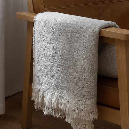 Light pure cotton grey gauze blanket from The Finishing Touch Decor, showing soft, breathable fabric with a gentle drape.