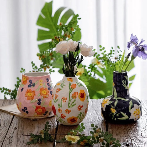 French hand-painted ceramic mug by The Finishing Touch Decor with floral patterns, ideal for home decor and retro flower arrangements.