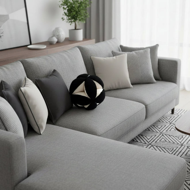 Modern round geometric throw pillow with spherical design, made by The Finishing Touch Decor, showcasing a stylish accent for living spaces.
