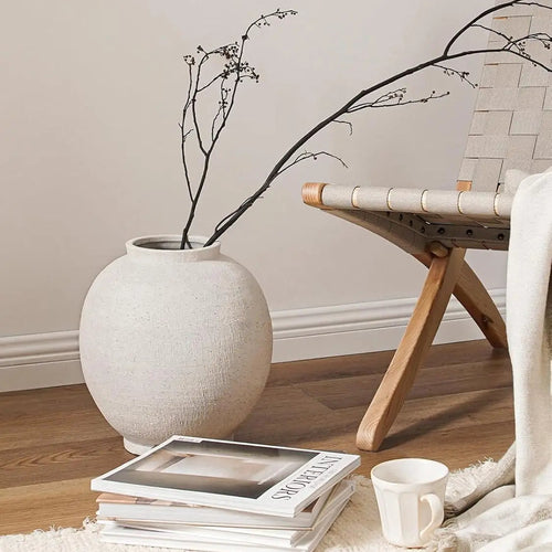 Large white sandstone ceramic round floor vase for decorative display, featuring smooth surface and elegant design.