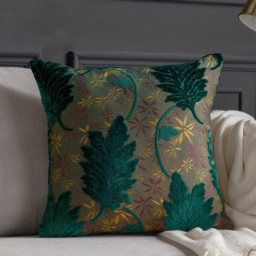 Vibrant embroidered leaf design throw pillow cover from The Finishing Touch Decor, featuring colorful leaf patterns on fabric.