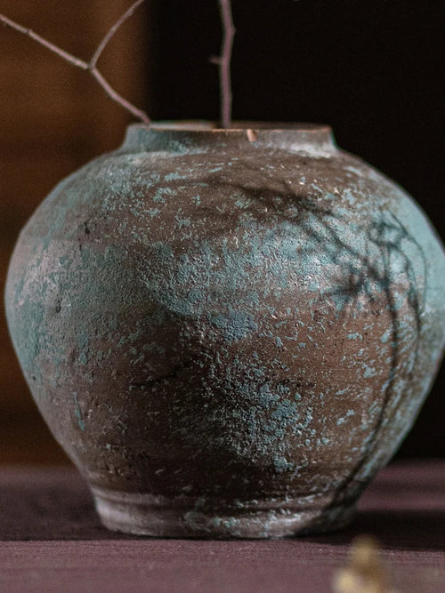 Retro thick earthenware vase by The Finishing Touch Decor, ideal as a decorative dried flower holder in a mid-century modern style.