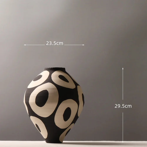 Ceramic vase with hand-drawn geometric circle design, perfect for flower arrangements and home decor by The Finishing Touch Decor
