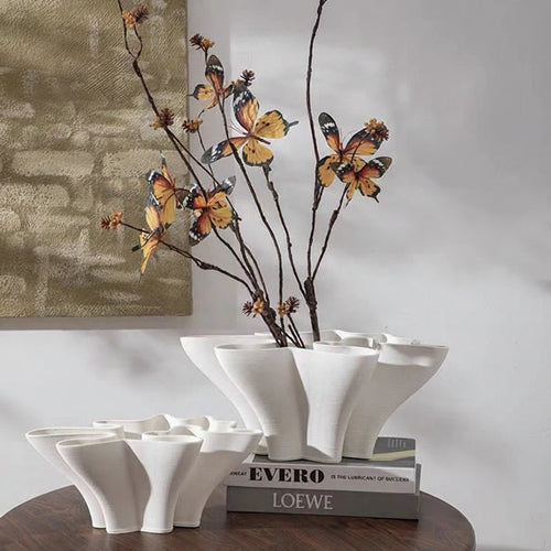 White ceramic Sculpted Waves Scandi vase by The Finishing Touch Decor, featuring a modern, textured wave design for decorative display.