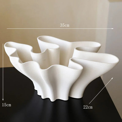 White ceramic Sculpted Waves Scandi vase by The Finishing Touch Decor, featuring a modern wave design perfect for decorative use.
