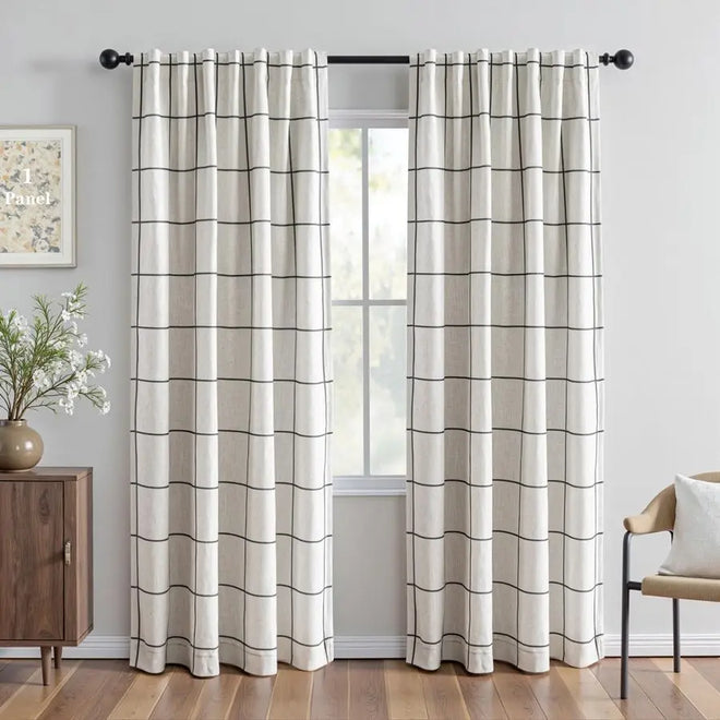 Horizontal stripe coastal linen blackout curtains by The Finishing Touch Decor, showing black and white striped fabric for window coverage.