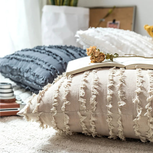 Boho textured fringe throw pillow cover by The Finishing Touch Decor with intricate woven details and fringe accents.