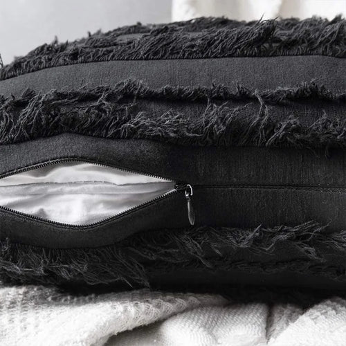 Boho textured fringe throw pillow cover by The Finishing Touch Decor with woven design and decorative fringe details.