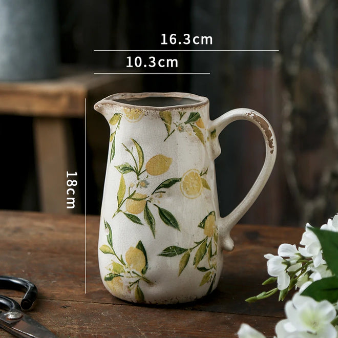Decorative farmhouse cottage pitcher vase from The Finishing Touch Decor, with a rustic design and vintage charm.
