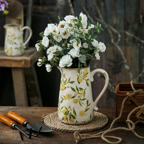 Decorative retro farmhouse cottage pitcher vase with distressed finish, ideal for rustic floral arrangements or farmhouse decor style.