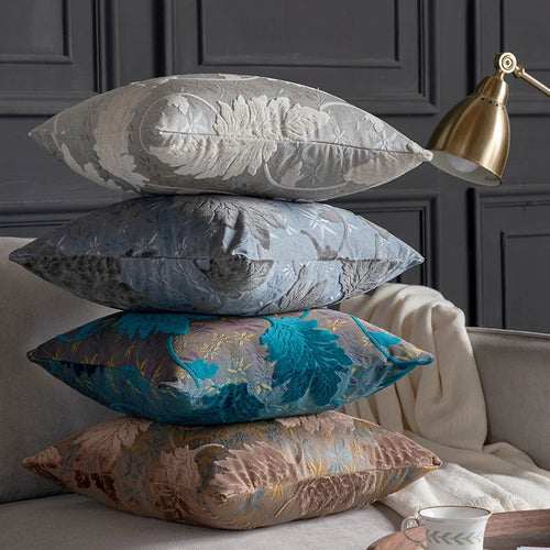 Vibrant embroidered leaf design on decorative throw pillow cover from The Finishing Touch Decor, perfect for sofa or chair accents.