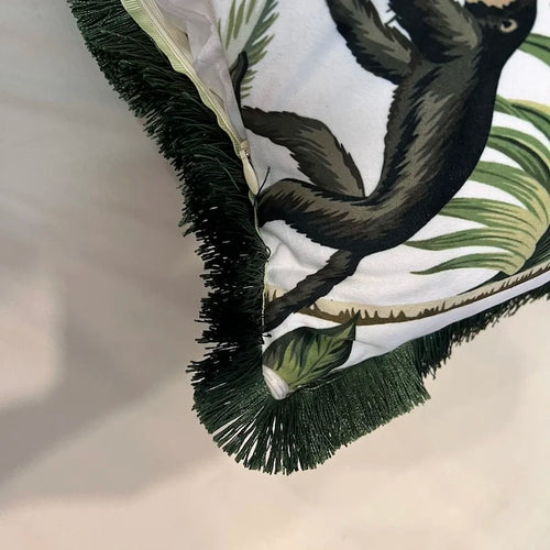 Velvet tropical monkey and palm tree throw pillow cover from The Finishing Touch Decor, featuring vibrant jungle print and soft texture.