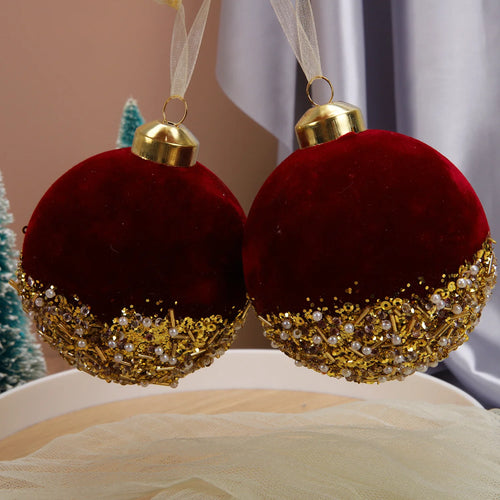 Red velvet and glitter Christmas ball ornaments for holiday decor, featuring festive red velvet with sparkling glitter accents.