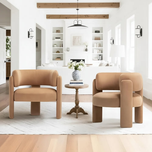 Pair of tan modern velvet barrel armchairs from The Finishing Touch Decor, stylish small furniture for living rooms.