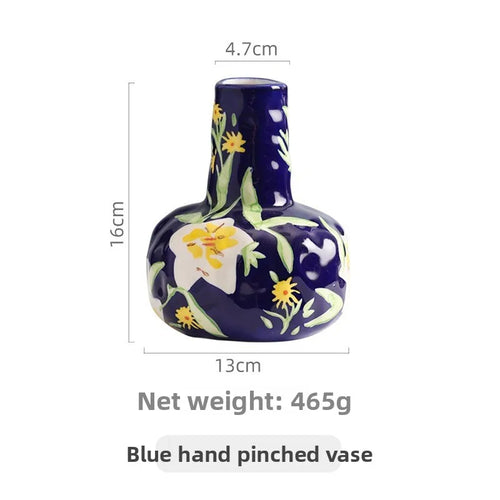 French hand-painted ceramic mug from The Finishing Touch Decor with floral design, used as a luxurious home decor floral vase.