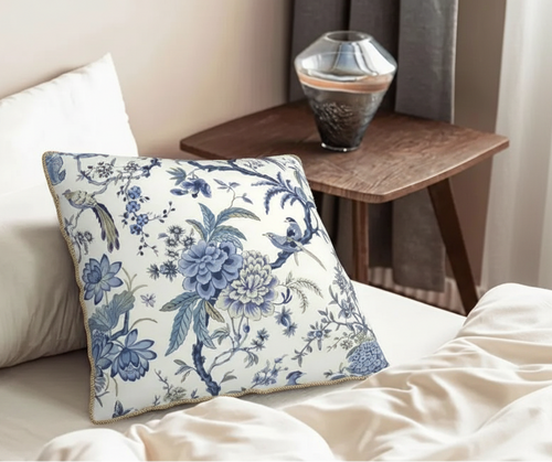 Soft white and blue sparrow throw pillow cover from The Finishing Touch Decor, featuring detailed bird and floral design.