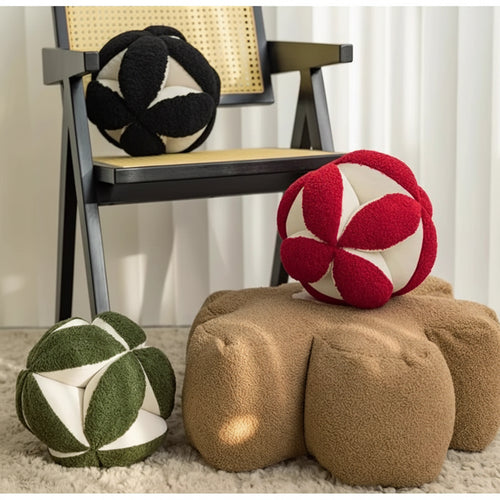 Modern round geometric ball throw pillows from The Finishing Touch Decor with stylish, contemporary design and soft fabric.