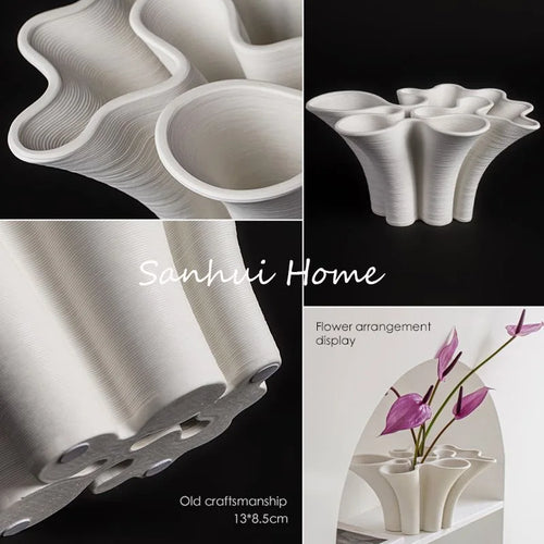 White ceramic Scandi vase with sculpted wave design, decorative vase from The Finishing Touch Decor, ideal for modern home décor.