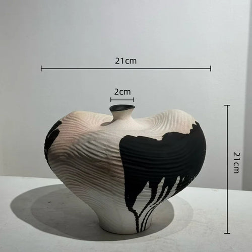 Handmade decorative vase with irregular ink drip design, showcasing a unique, artistic shape perfect for modern home decor.