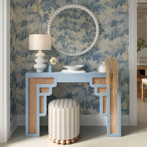 Coastal blue and beige striped linen ottoman stool from The Finishing Touch Decor, small furniture piece with fabric upholstery.