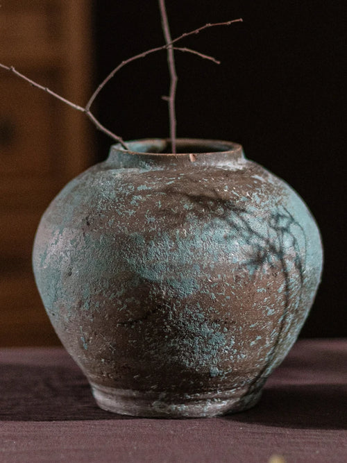 Decorative retro thick earthenware vase by The Finishing Touch Decor, ideal for dried flowers and mid-century modern living room decor.