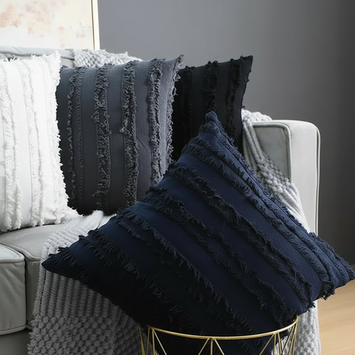 Boho textured fringe throw pillow cover by The Finishing Touch Decor showing beige fabric with fringe detailing and decorative texture.